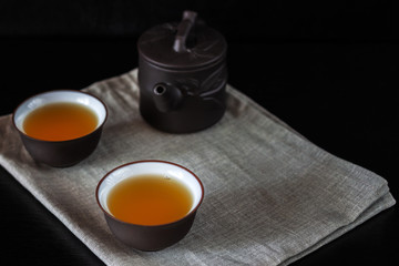 Chinese brown teapot and cups for tea