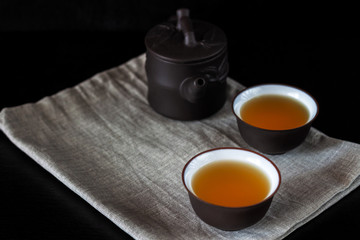 Chinese brown teapot and cups for tea