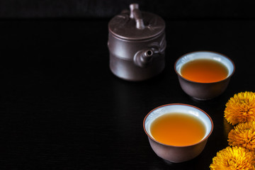 Chinese brown teapot and cups for tea