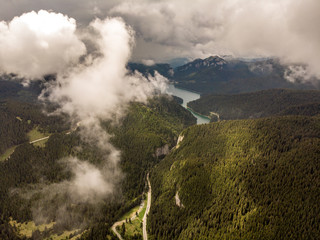 Bolboci Lake in the Carpathians and Tatar Gorge on a cold foggy autum morning