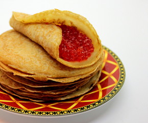 Delicious homemade pancakes with red caviar