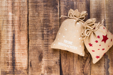 Christmas greeting card wooden background.