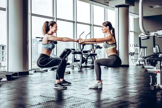 Sport concept.Beautiful women doing exercise in gym.