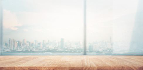 Empty wood table with blur  window city view background.For montage product display or design key visual
