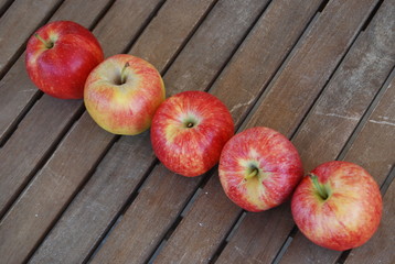 Row of Red Apples on Table