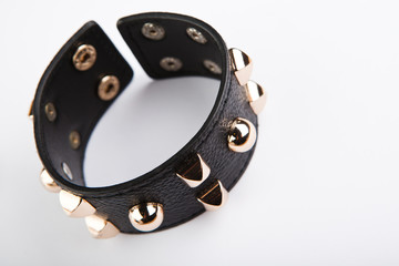 Obraz premium Black leather bracelet studio white background 