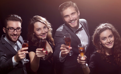 happy young people with a glass of wine.