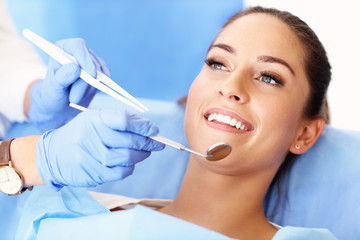 Adult woman having a visit at the dentist's