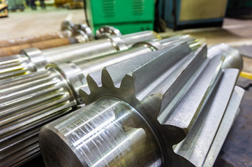 Shaft gear on rack after machining.