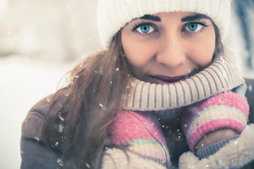Beautiful woman at cold snowy winter walking at New York