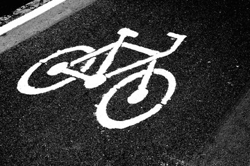 bicycle lane sign on asphalt road