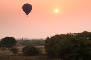 Hot air balloons rise over the plains of Bagan, a historical site in Myanmar, in the early morning
