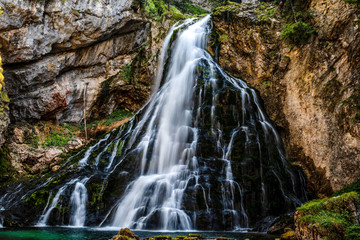 Fototapeta na wymiar Beautiful view of famous Gollinger Wasserfall with mossy rocks and green trees, Golling, Salzburger Land, Austria