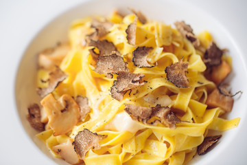 Pasta with truffles, typical autumn dish.Restaurant menu dish.