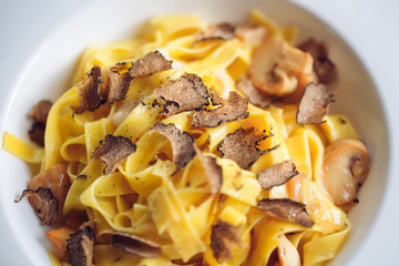 Pasta with truffles, typical autumn dish.Restaurant menu dish.