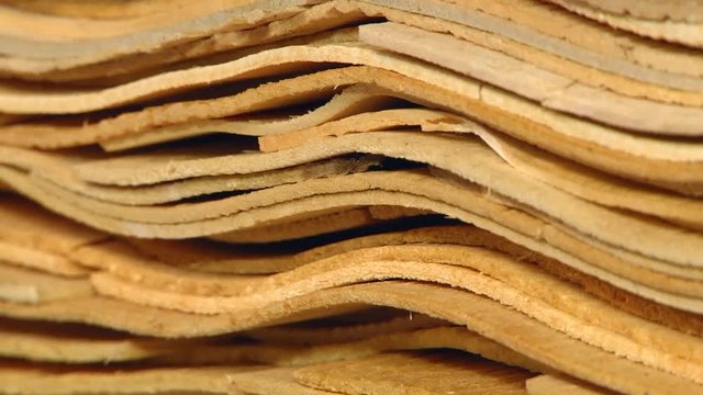 Production technology of plywood at the plant. Prepared veneer sheets. Furniture factory. Production of plywood. Automated production of plywood sheets.  Veneer bundles.