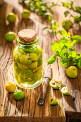 Homemade quince tincture made of fruits and alcohol