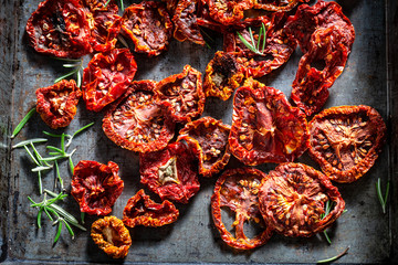 Delicious tomatoes dried in the sun on baking tray