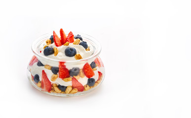 Healthy berry fruit yogurt in a jar isolated on a white background