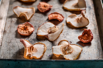 Fototapeta na wymiar Homemade dried apples on old baking tray