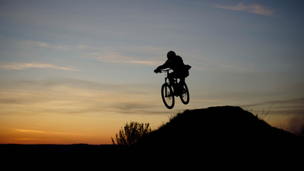 Fototapeta na wymiar silhouette of biker in sunset