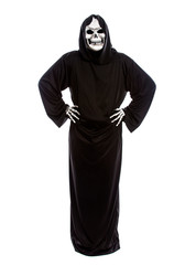 Halloween costume of a skeleton grim reaper wearing a black robe on a white background looking...