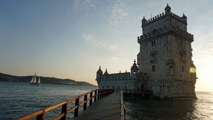 sunset at the tower of belem in lisbon