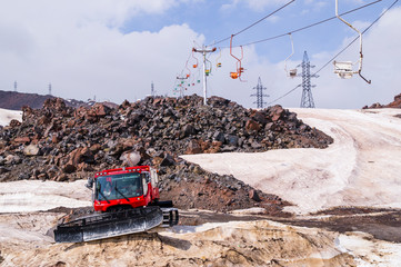 Elbrus summer 2018. Mountain landscape. Snow removal machine.