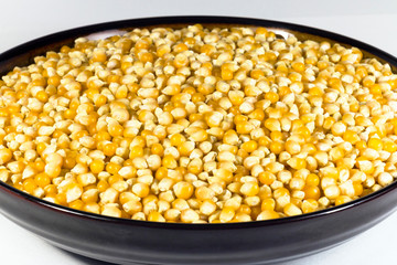 Beautiful plate with unpopped corn (popcorn kernel's)