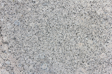Granite Texture Close Up View of Grey and White Color Mineral Stone. Simple Stoned Surface of Natural Granite Material Background. Abstract Empty Seamless Backdrop Top View with Empty Copy Space