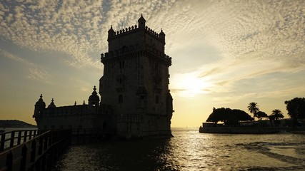 sunset at the tower of belem in lisbon