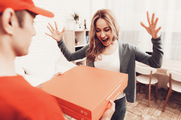 Happy Woman Looking at Pizza Box and Courier.