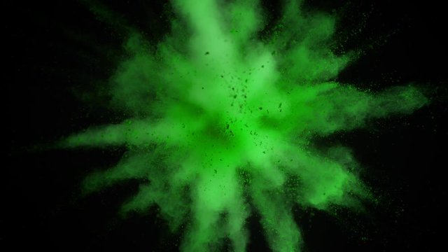 Super slowmotion shot of green powder explosion isolated on black background. Shot with high speed cinema camera at 1000fps