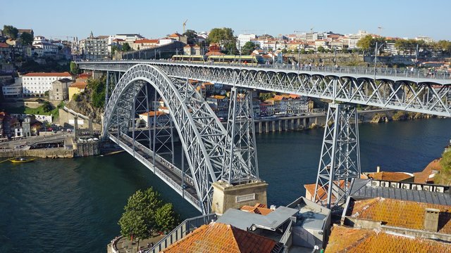 douro river in porto with dom luis bridge and houses