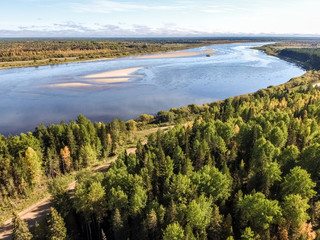 Fototapeta na wymiar The Pinega River. Golden autumn in the Russian North.