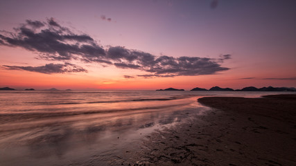 Fototapeta na wymiar Sunset over Lebuan Bajo beach