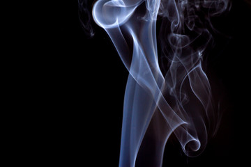 Thick smoke on a black isolated background. Background from the smoke of vape
