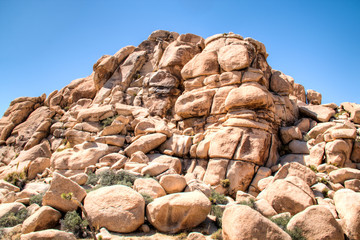 Joshua Tree National Park with its typical trees and rock formations near Palm Springs in the California desert in the USA
