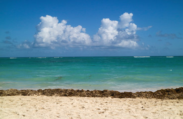 Peaceful skyline with sky clouds sea and sand in Caribbean beach