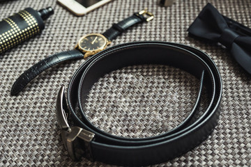 different accessories of a businessman for creating a style of a people lie on a wooden background