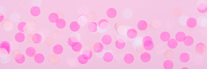 Creative pastel fantasy holiday card with pink party confetti. Baby shower, birthday, celebration concept.