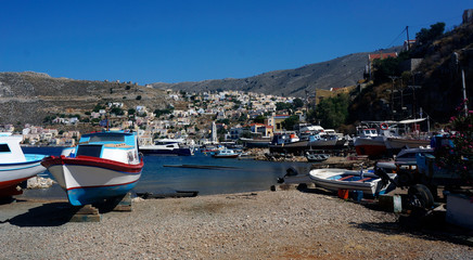 Fototapeta na wymiar fishing boats pier sуmi island greece