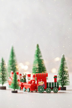 Christmas background with miniature toys with wither scenes, seasonal Christmas, new year and winter decorations