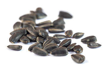 Sunflower seeds isolated on white background, close up
