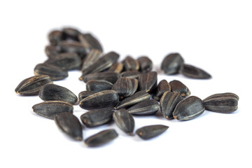 Sunflower seeds isolated on white background, close up