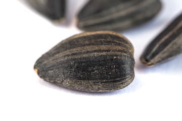 Sunflower seeds isolated on white background, close up
