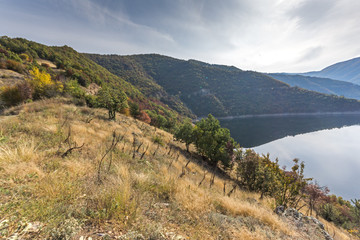 Fototapeta na wymiar Autumn ladscape of The Vacha (Antonivanovtsi) Reservoir, Rhodope Mountains, Plovdiv Region, Bulgaria