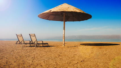 Sun loungers and umbrellas on the beach of Agios Ioannis village in Greece on Aug. 10, 2018