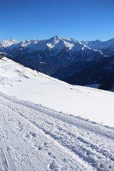 Wintery mountain landscape with sunshine