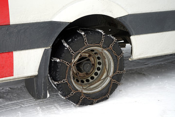 Winter chains on bus wheel.